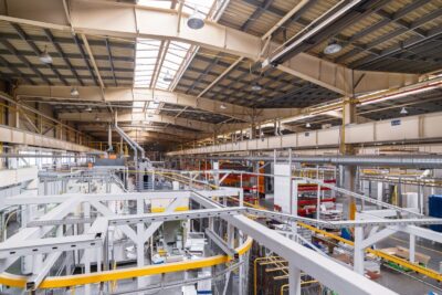 Industrial line of dry painting of metal products. Overhead conveyor system.